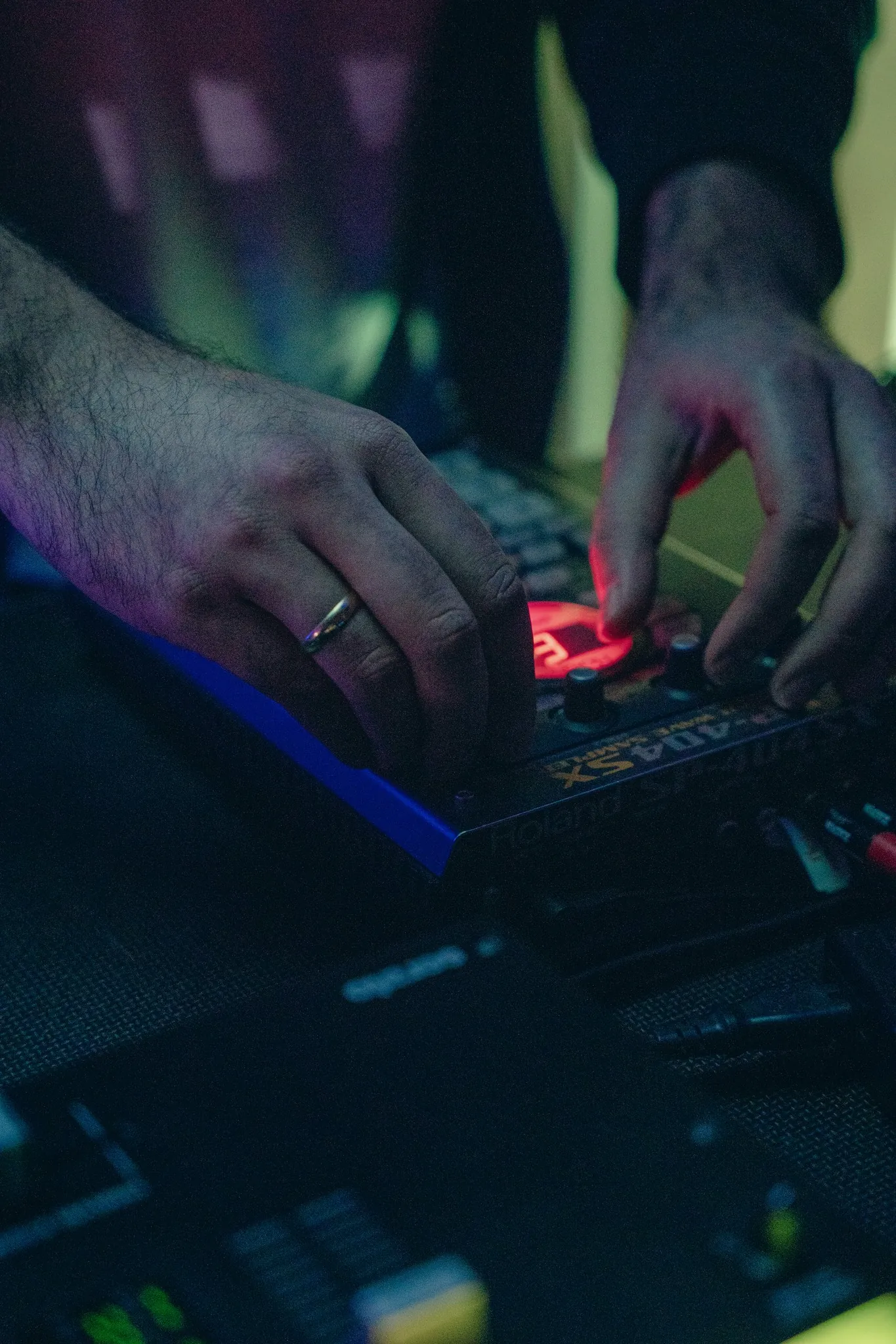 Jan — solo dev and beatmaker — hands on a Roland SP-404SX during a session.